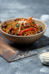 Korean authentic cuisine, Japchae or glass noodles stir fried with vegetables